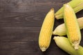 Fresh organic yellow sweet corn on wooden table. Top view Royalty Free Stock Photo