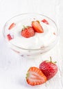 Fresh organic yogurt with strawberries on wood Royalty Free Stock Photo