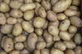 Fresh organic young potatoes sold at a street market in the city of Singapore, closeup Royalty Free Stock Photo