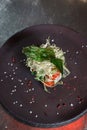 Fresh organik salad on a round stone plate