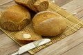 Fresh out of oven, home made whole wheat bread cooling on bamboo mat.