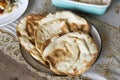 Fresh oven baked naan on wooden table