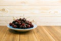 Fresh Overripe ripe Cherries on Blue Rustic Wooden Background Royalty Free Stock Photo