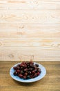 Fresh Overripe ripe Cherries on Blue Rustic Wooden Background Royalty Free Stock Photo