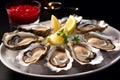 Fresh oyster dish placed on plate with ice and lemon