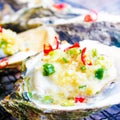 Fresh oysters close-up on a dish, served with oysters, lemon and ice. Healthy seafood. Oyster dinner with champagne in a Royalty Free Stock Photo