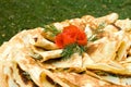 Fresh pancakes decorated with tomato rose