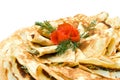 Fresh pancakes decorated with tomato rose on white