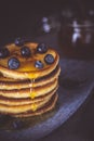 Fresh Pancakes with Organic Maple Syrup and Berries on Dark Background Royalty Free Stock Photo