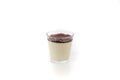 Fresh panna cotta in a glass isolated on a white background