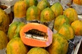 Fresh papaya fruit symmetrically to attract buyers at market stall Royalty Free Stock Photo