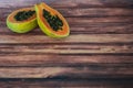 Fresh papaya on wooden background Royalty Free Stock Photo