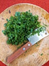 Fresh parsley leaves on a round wooden board