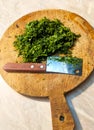 Fresh parsley leaves on a round wooden board Royalty Free Stock Photo