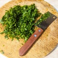 Fresh parsley leaves on a round wooden board Royalty Free Stock Photo