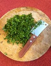 Fresh parsley leaves on a round wooden board