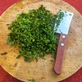 Fresh parsley leaves on a round wooden board