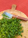 Fresh parsley leaves on a round wooden board Royalty Free Stock Photo