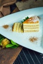 Fresh passion fruit cake with coconut and cinnamon. Dessert on plate. The restaurant or cafe atmosphere Royalty Free Stock Photo