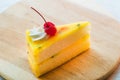 Fresh passion fruit cake dessert on wooden plate Royalty Free Stock Photo