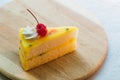 Fresh passion fruit cake dessert on wooden plate Royalty Free Stock Photo