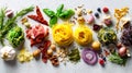 Fresh pasta with assorted herbs, spices, and vegetables spread out on a light surface Royalty Free Stock Photo