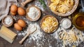 Fresh pasta ingredients and tools on a rustic wooden table, top view. Royalty Free Stock Photo