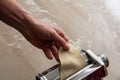 Fresh pasta maker machine. Dough homemade preparation. Hand make dough phylo close up view Royalty Free Stock Photo