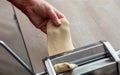 Fresh pasta maker machine. Dough homemade preparation. Hand make dough phylo close up view Royalty Free Stock Photo