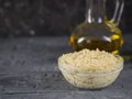 Fresh pasta tahini from sesame seeds with olive oil and garlic on a black wooden table. Royalty Free Stock Photo