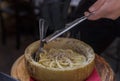 Fresh pasta with truffle in pecorino cheese wheel in restaurant, Florence, Italy Royalty Free Stock Photo