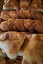 Fresh pastries on wooden plates: triangular samosas samosas with meat, sochen sochnik sweet made from shortcrust pastry
