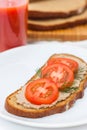 Fresh pate on bread with tomatoes