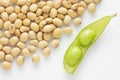 Fresh pea pod and dry soybean on white background. Royalty Free Stock Photo