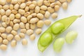 Fresh pea pod and dry soybean on white background. Royalty Free Stock Photo