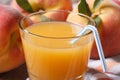 Fresh peach juice in glass closeup on a background of ripe fruit Royalty Free Stock Photo