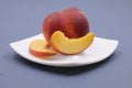 Fresh peach on the plate Royalty Free Stock Photo