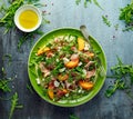 Fresh Peach salad with Parma ham, feta cheese and vegetables in a green plate. healthy food Royalty Free Stock Photo