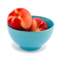 Fresh peaches in blue bowl Royalty Free Stock Photo