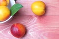 Fresh peaches close-up on a wooden background, fruit still life. Flat lay, top view, copy space Royalty Free Stock Photo