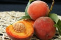 Fresh peaches with flesh and pit exposed Royalty Free Stock Photo