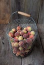 Fresh peaches fruits with in basket on dark wooden rustic background, top view. Summer harvest of fruits. Still life. A group of Royalty Free Stock Photo