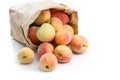 Fresh peaches in paper bag isolated Royalty Free Stock Photo