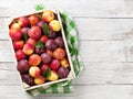 Fresh peaches and plums Royalty Free Stock Photo