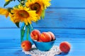 Fresh peaches and sunflowers Royalty Free Stock Photo