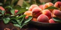 Fresh peaches with water drops in a decorative bowl on a wooden table Royalty Free Stock Photo