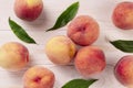 Fresh peaches on a wooden table