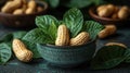 Fresh peanuts in a bowl with leaves Royalty Free Stock Photo