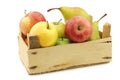 Fresh pears and apples in a wooden crate Royalty Free Stock Photo