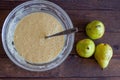 fresh pears and batter in a bowl for pie. Royalty Free Stock Photo